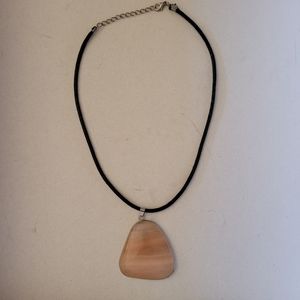 Pedant on leater string with polished agat.